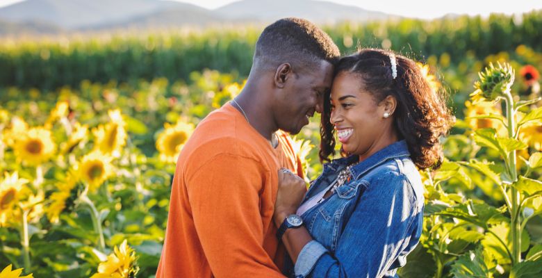 Couple embracing in the sunflower field